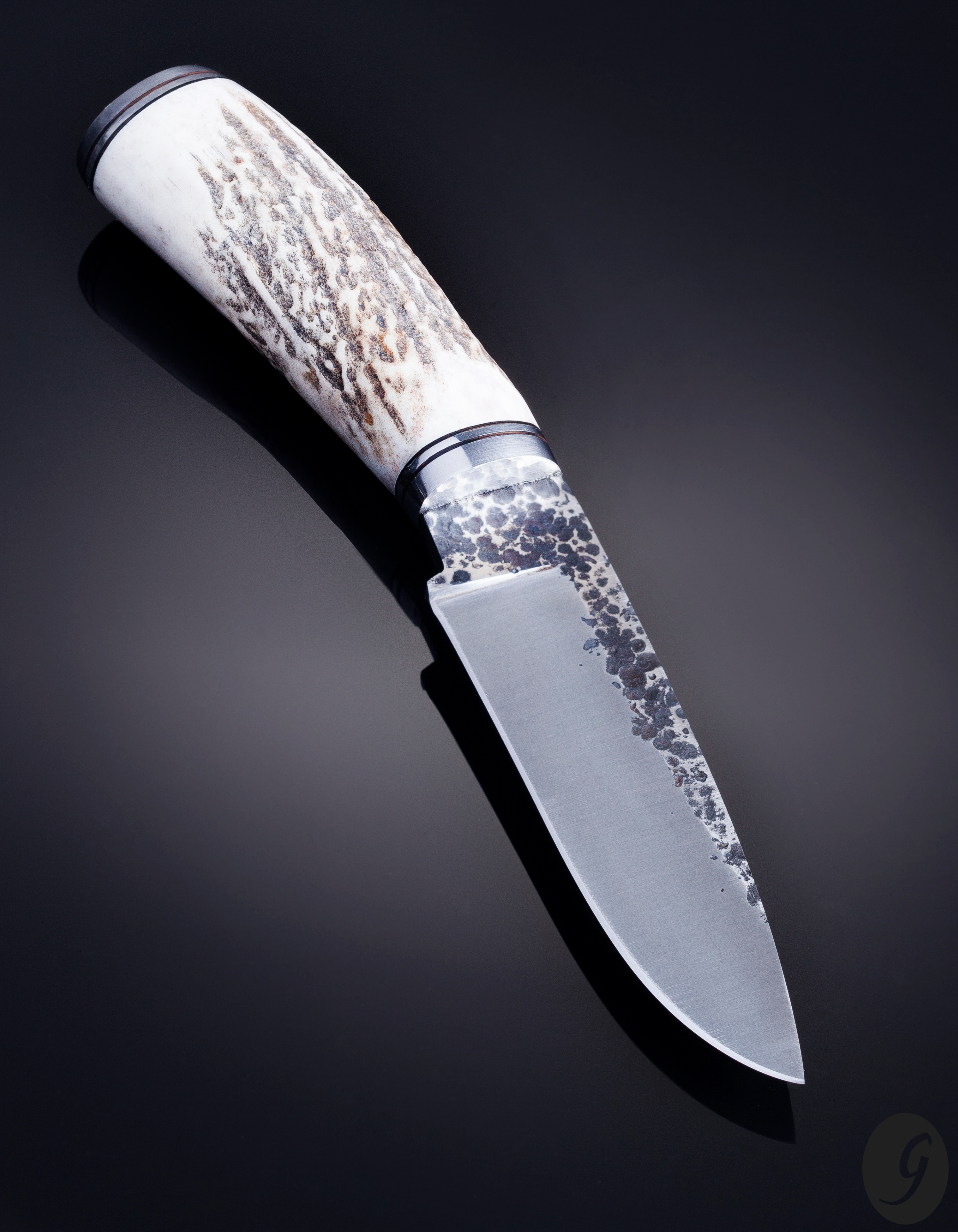Hammer textured carbon steel hunter with deer horn handle