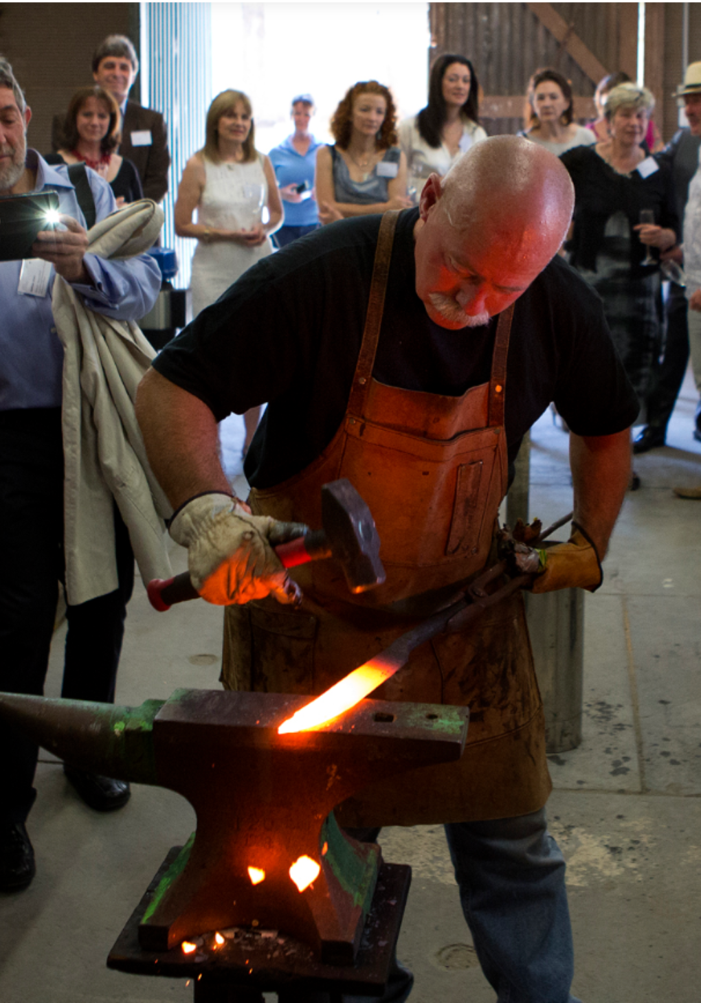 Chief Bladesmith, Barry Gardner, working on a knife hot out of the forge.